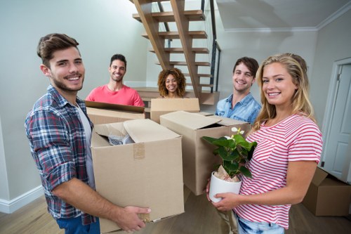 Local man and van removals team loading furniture in Elmersend
