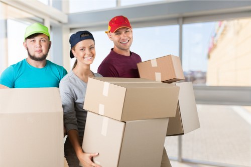 Removal team handling boxes and household items during an Elmersend relocation