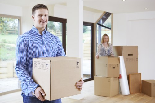 Packed boxes and furniture ready for a moving van in Elmersend
