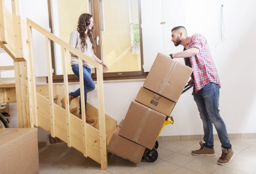 Local moving team handling boxes and furniture in Elmersend