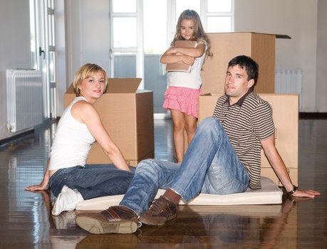 Packed moving boxes and furniture ready for transport in Elmersend